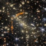 Webb Telescope Reveals Gravitational Lensing Effects in Distant Galaxy Cluster